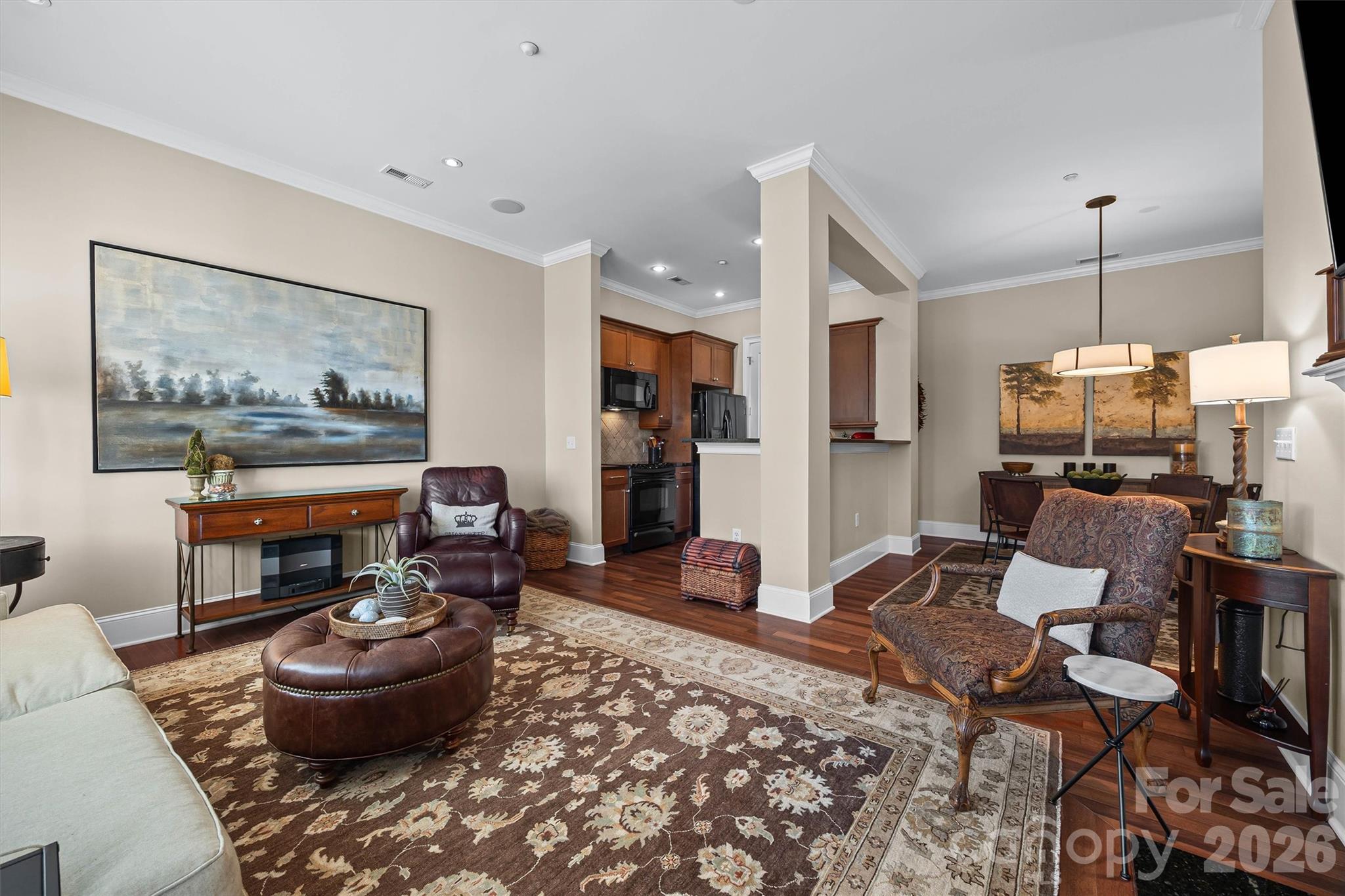 5425 Closeburn Road, Unit 214 Charlotte, NC 28210 - Photo 8 of 25 a living room with furniture and a wooden floor