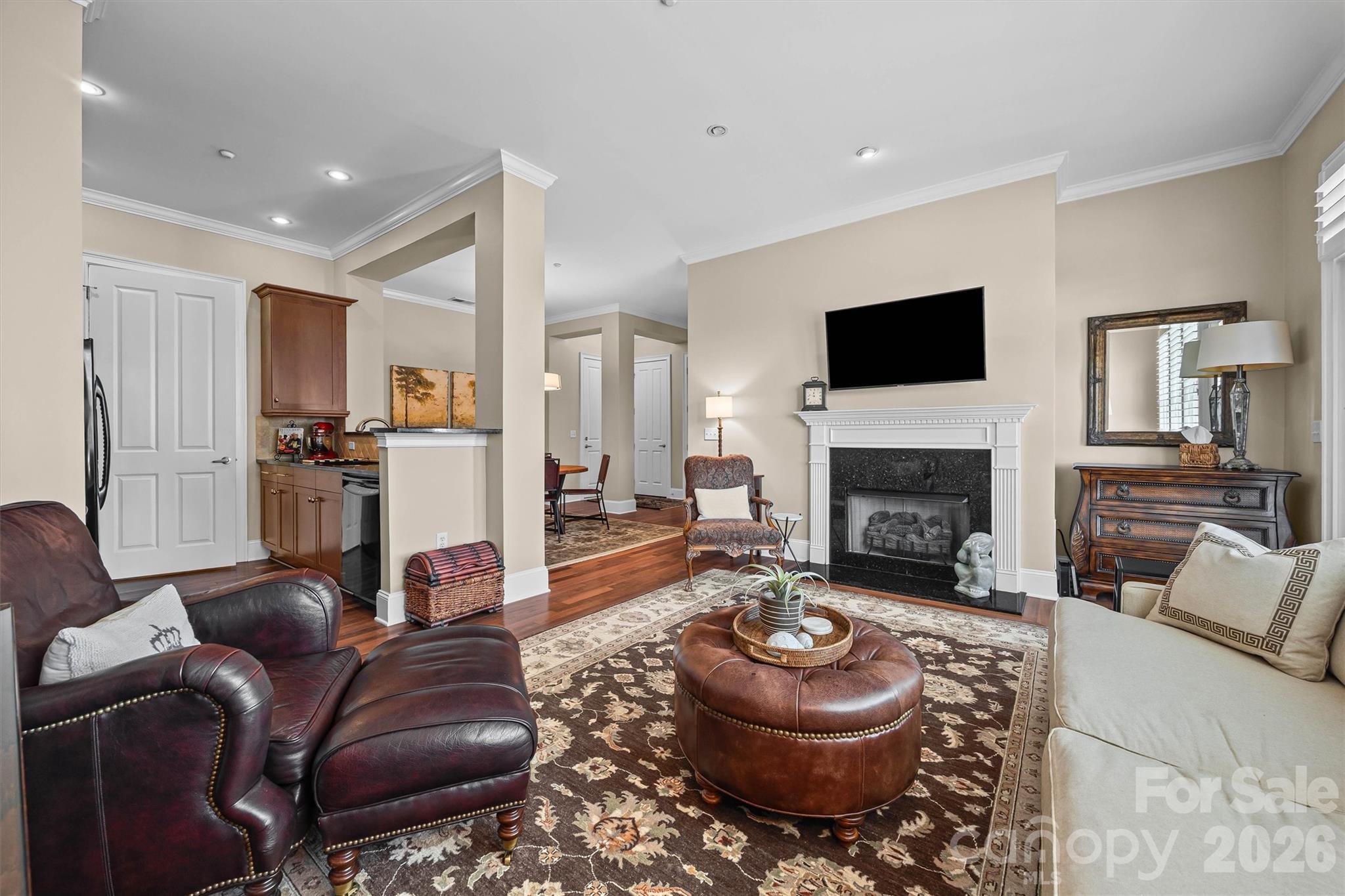 5425 Closeburn Road, Unit 214 Charlotte, NC 28210 - Photo 10 of 25 a living room with furniture a flat screen tv and a fireplace