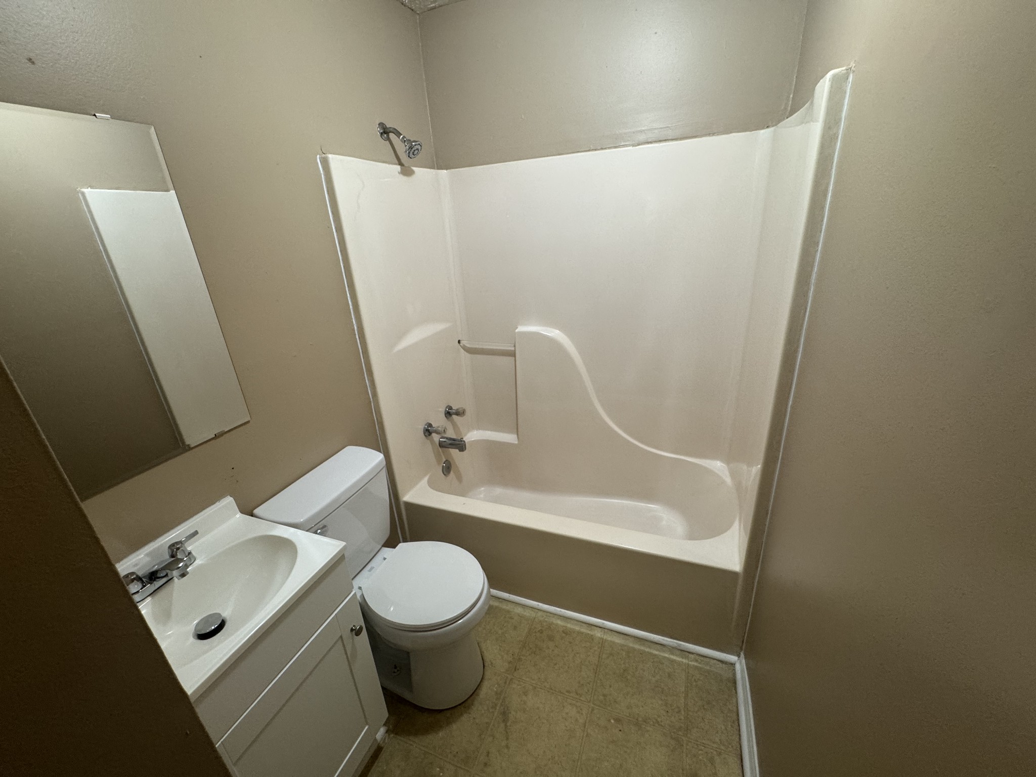 1589 Yager Road McMinnville, TN 37110 - Photo 3 of 5 a white toilet sitting next to a bathroom sink