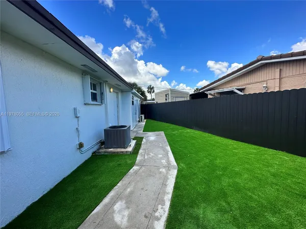 a view of a back yard of the house