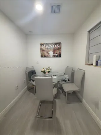 a view of a dining room with furniture