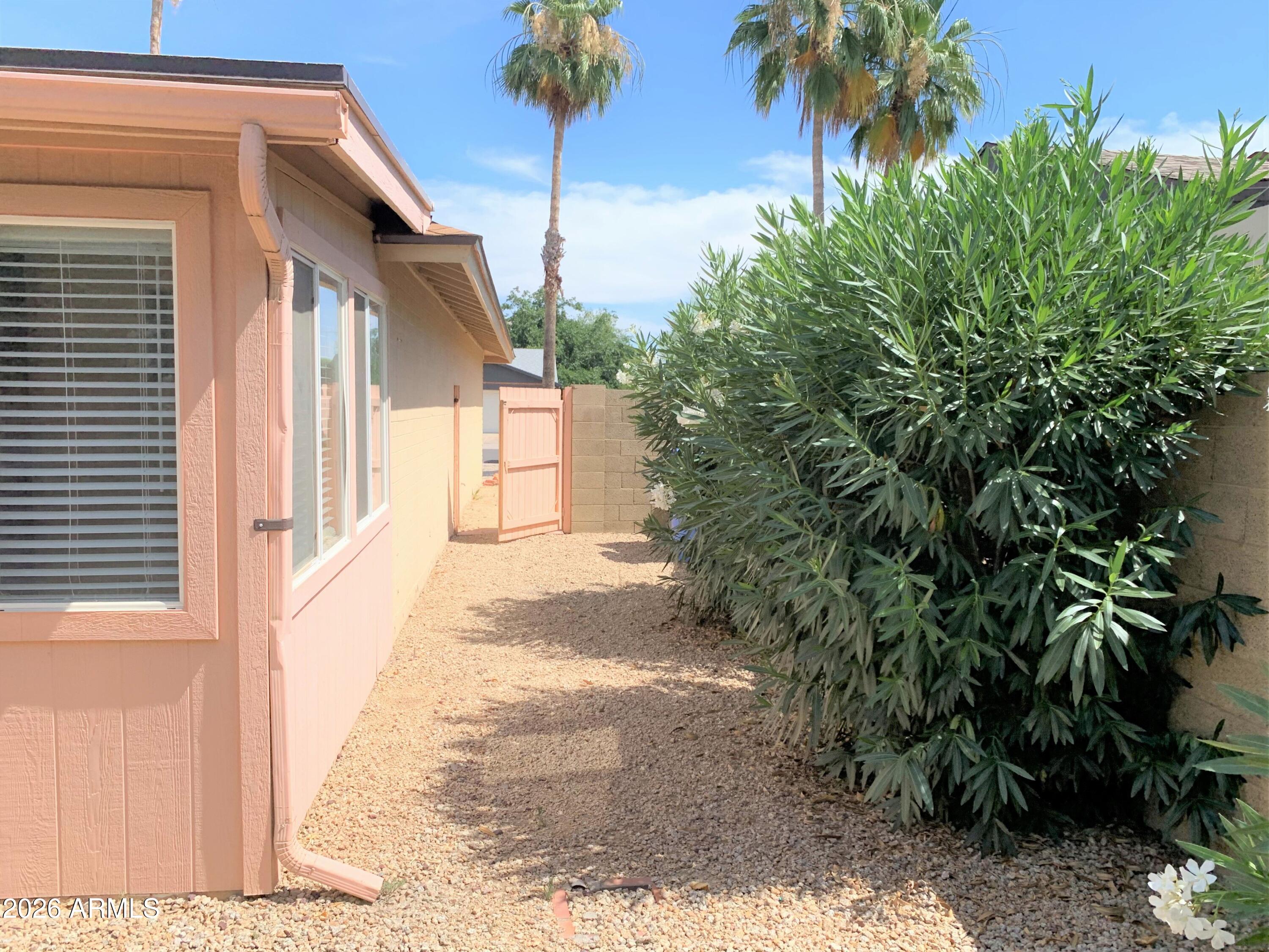 5916 East Spring Road Scottsdale, AZ 85254 - Photo 10 of 11 a view of a house with a yard