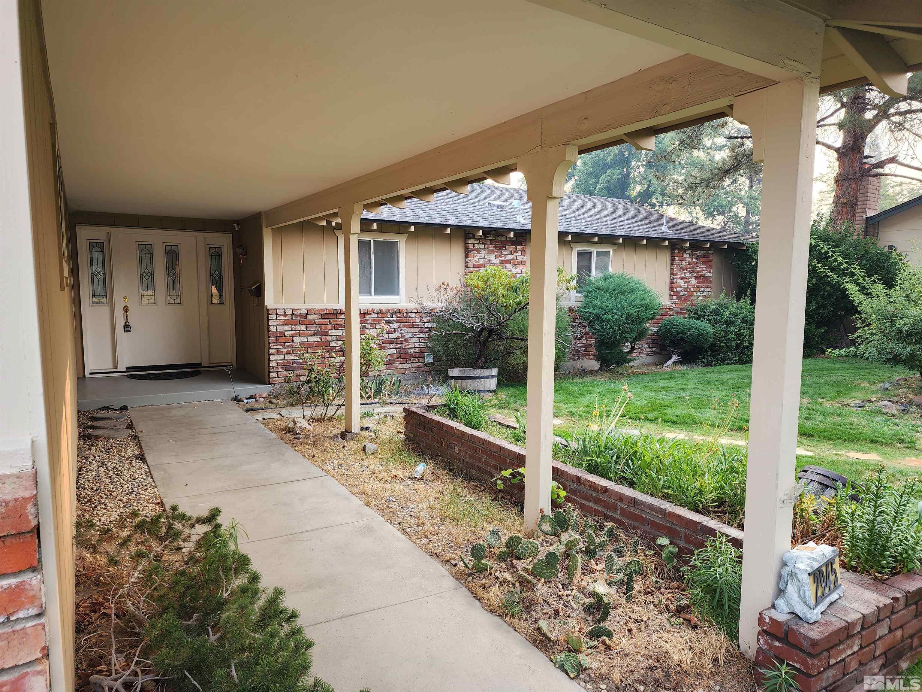 2945 Knight Road Reno, NV 89509 - Photo 2 of 11 a view of a house with backyard and porch