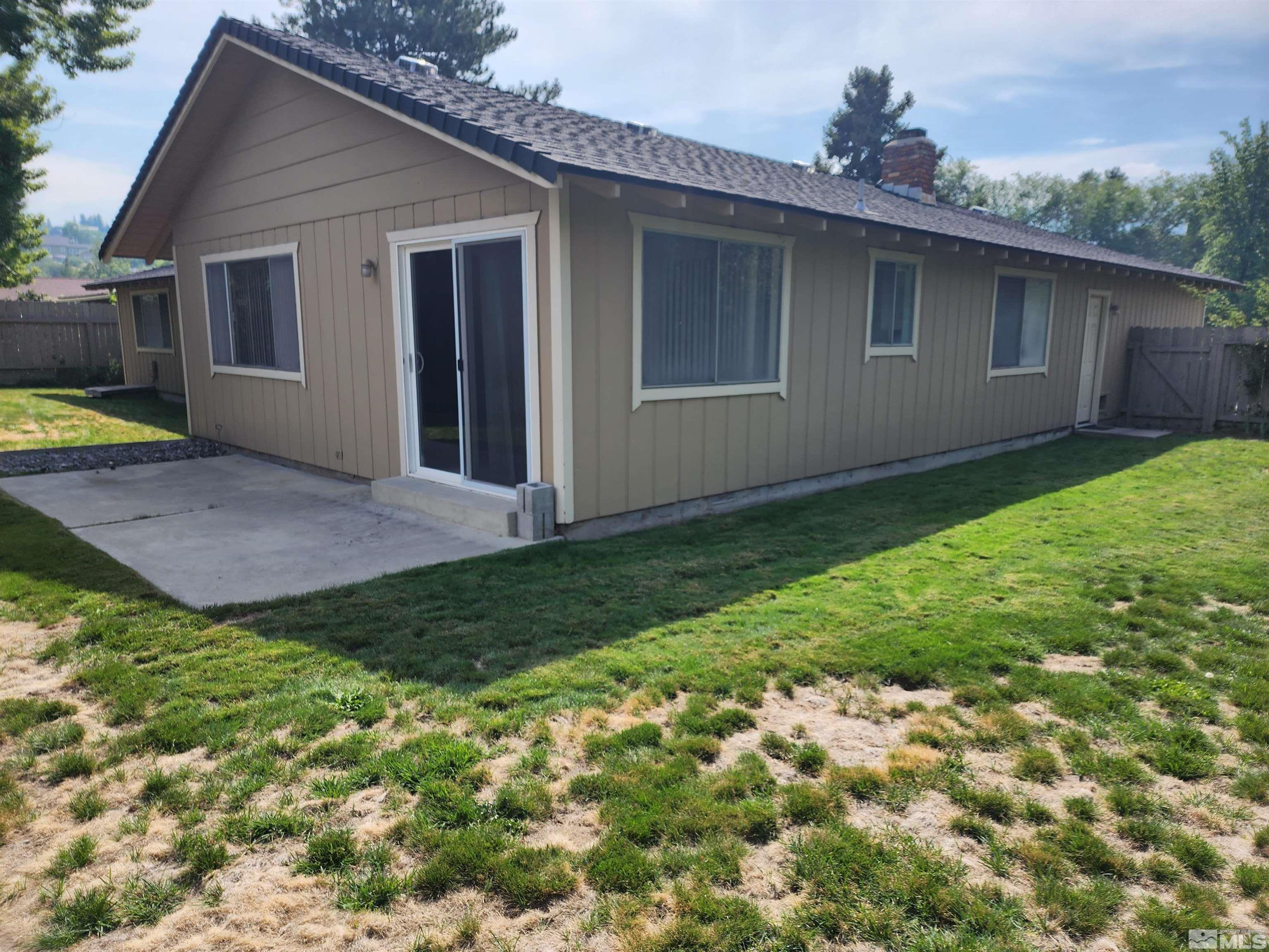 2945 Knight Road Reno, NV 89509 - Photo 10 of 11 a view of front of house with a yard
