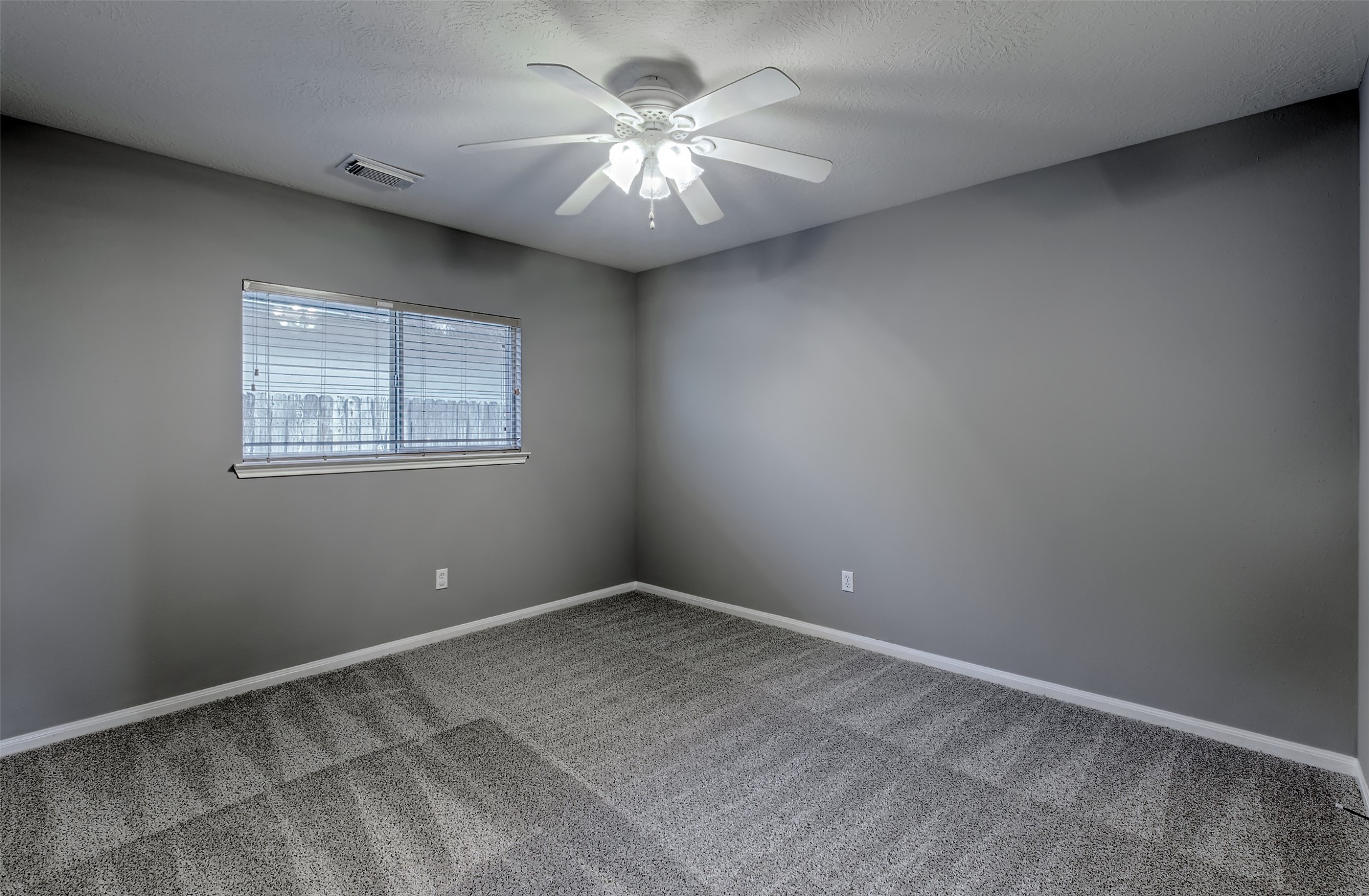 4018 Old Pine Grove Drive Humble, TX 77346 - Photo 12 of 26 a view of a room with windows and ceiling fan