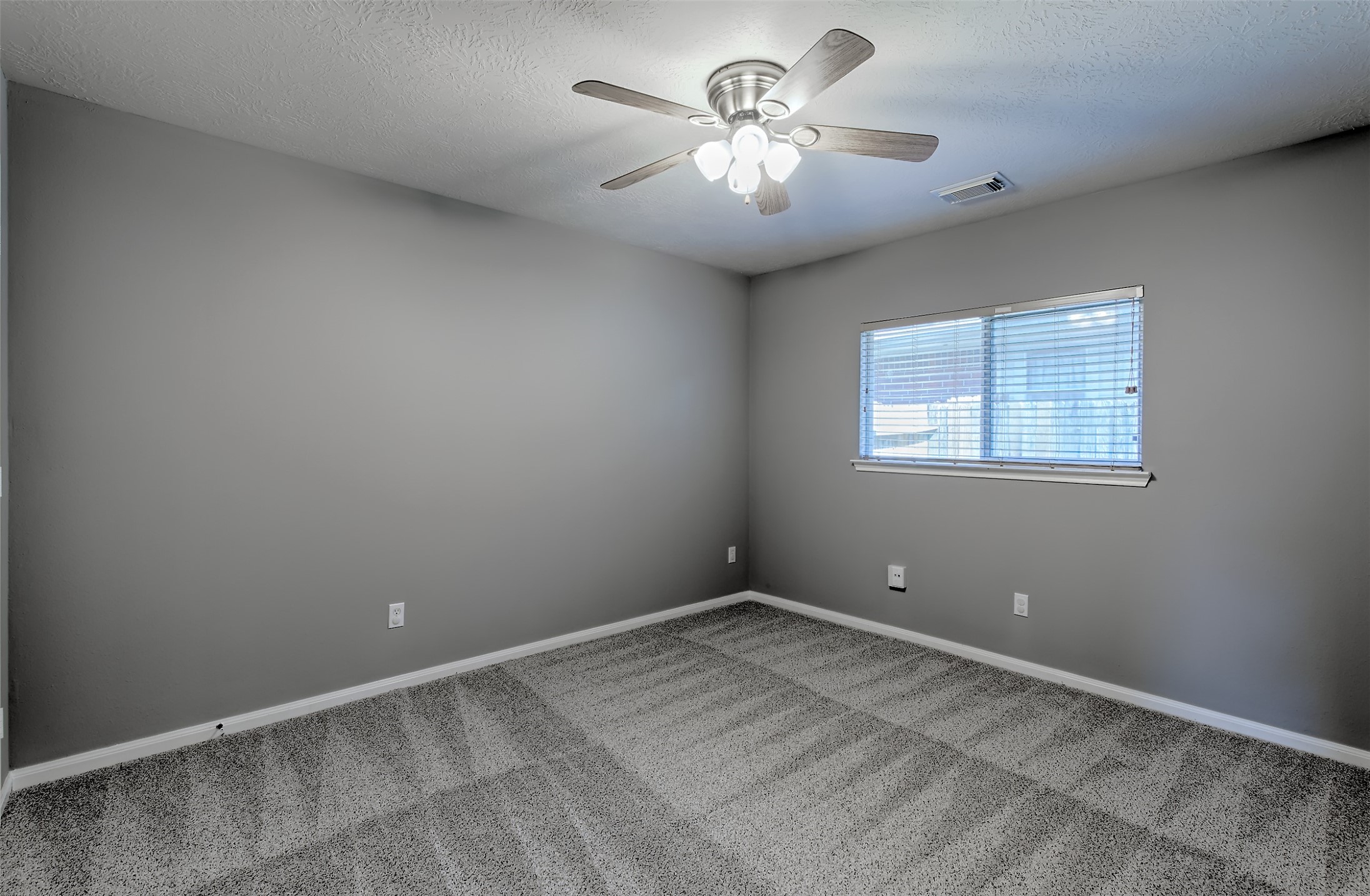 4018 Old Pine Grove Drive Humble, TX 77346 - Photo 13 of 26 a view of an empty room with a chandelier fan
