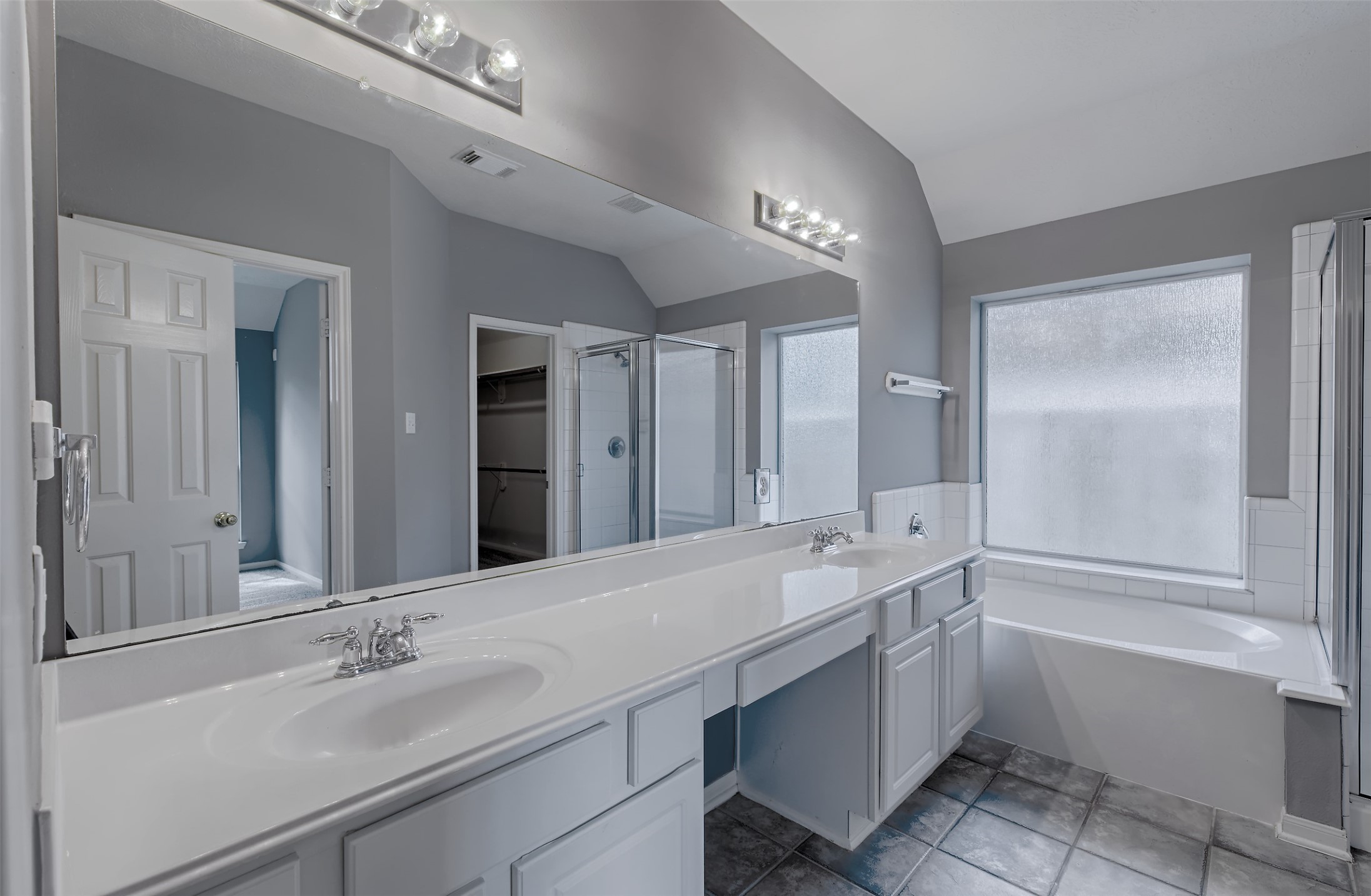 4018 Old Pine Grove Drive Humble, TX 77346 - Photo 21 of 26 a bathroom with a double vanity sink mirror and bathtub