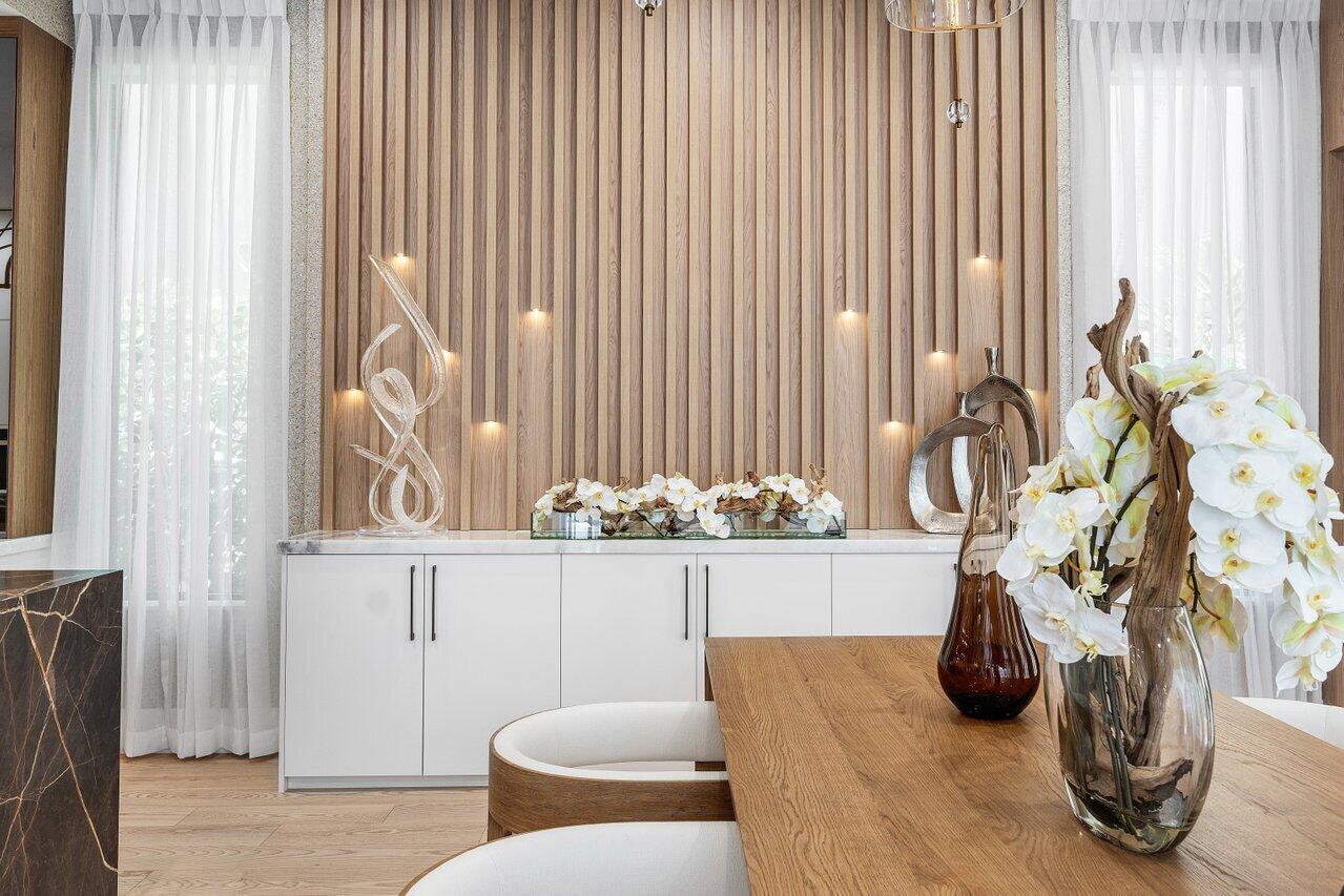 17709 Circle Pond Court Boca Raton, FL 33496 - Photo 16 of 50 a table that has a vase and flowers on it