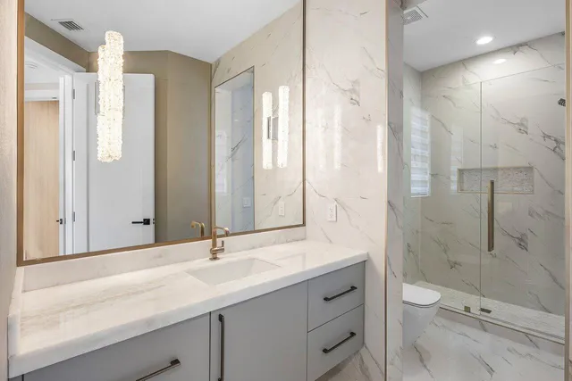 a bathroom with a toilet and sink