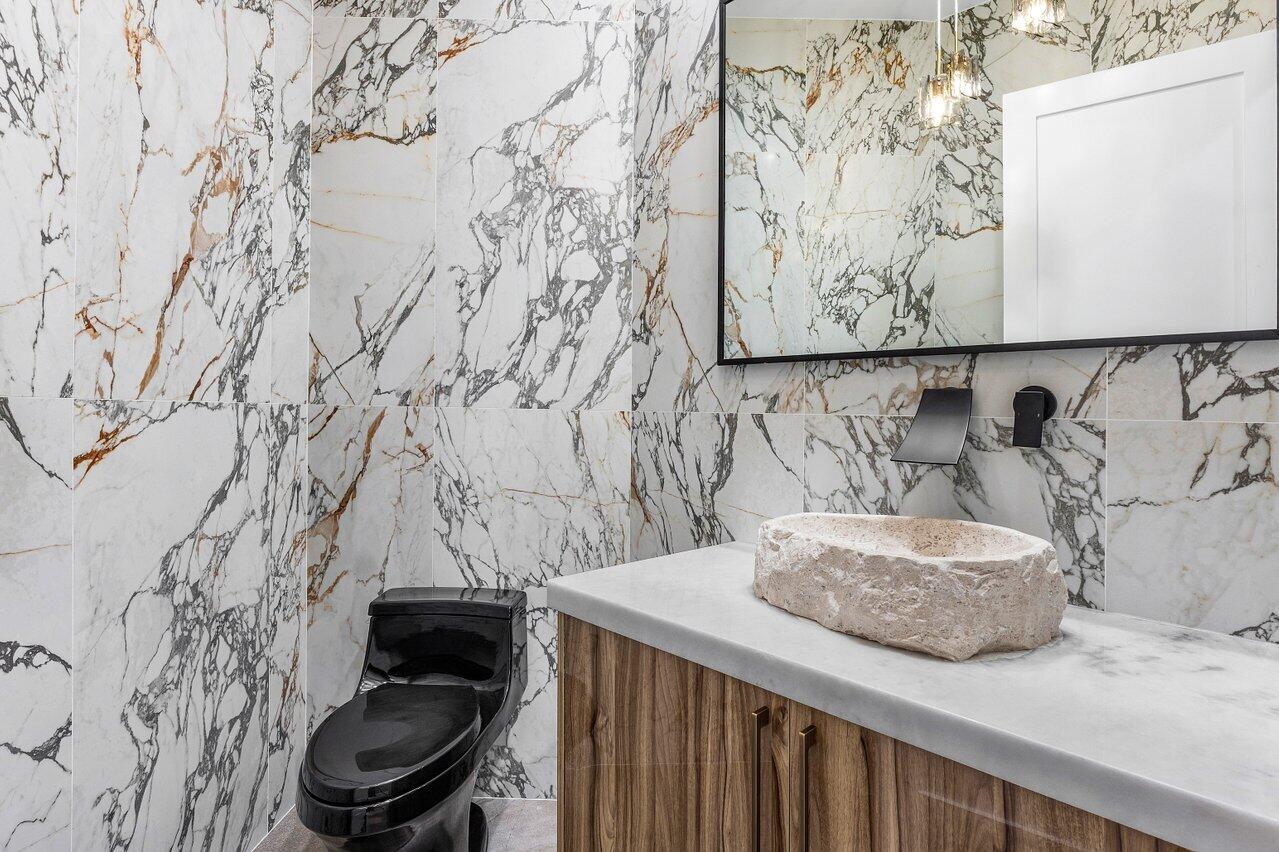 17709 Circle Pond Court Boca Raton, FL 33496 - Photo 30 of 50 a bathroom with a toilet and sink