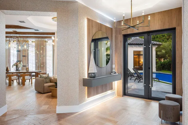 a view of a livingroom with furniture and floor to ceiling window