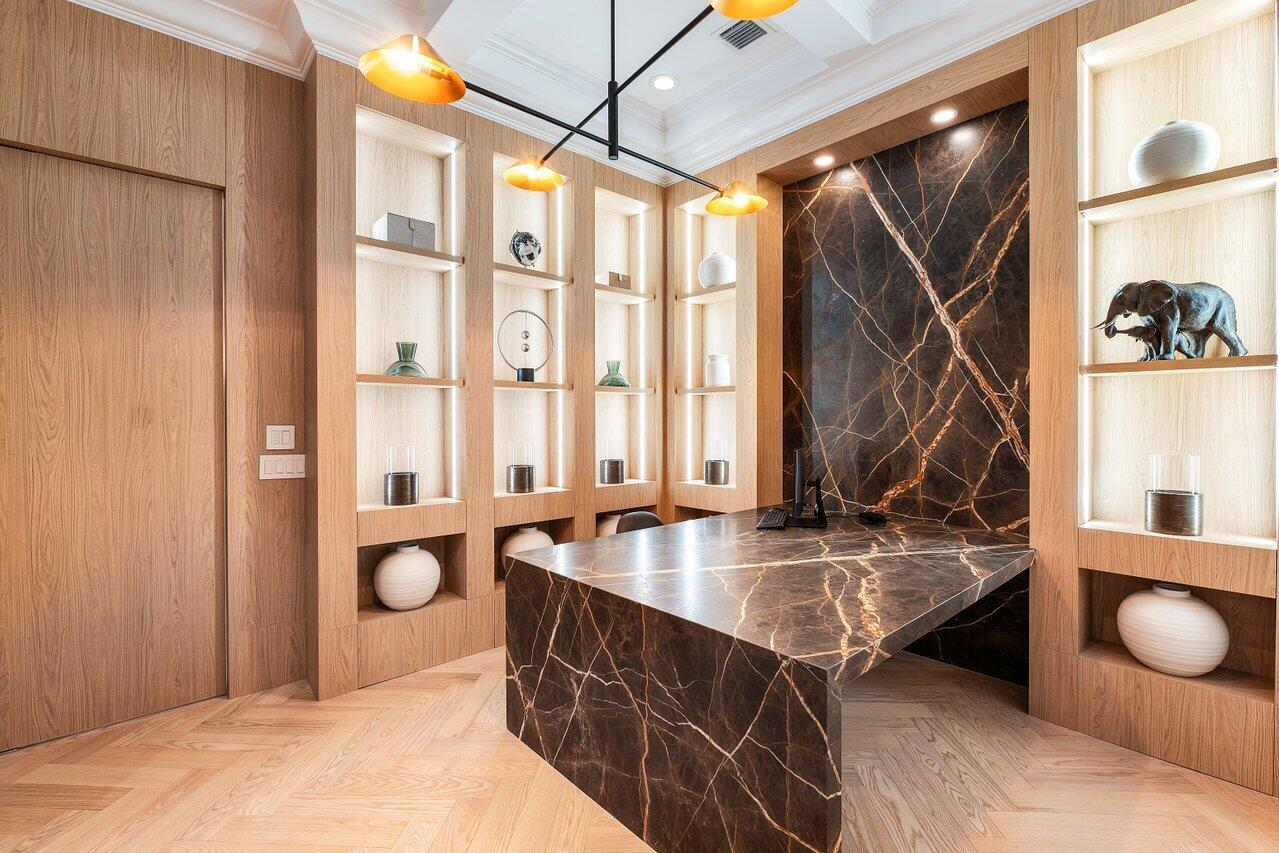 17709 Circle Pond Court Boca Raton, FL 33496 - Photo 31 of 50 a kitchen with a sink a counter and a living room area