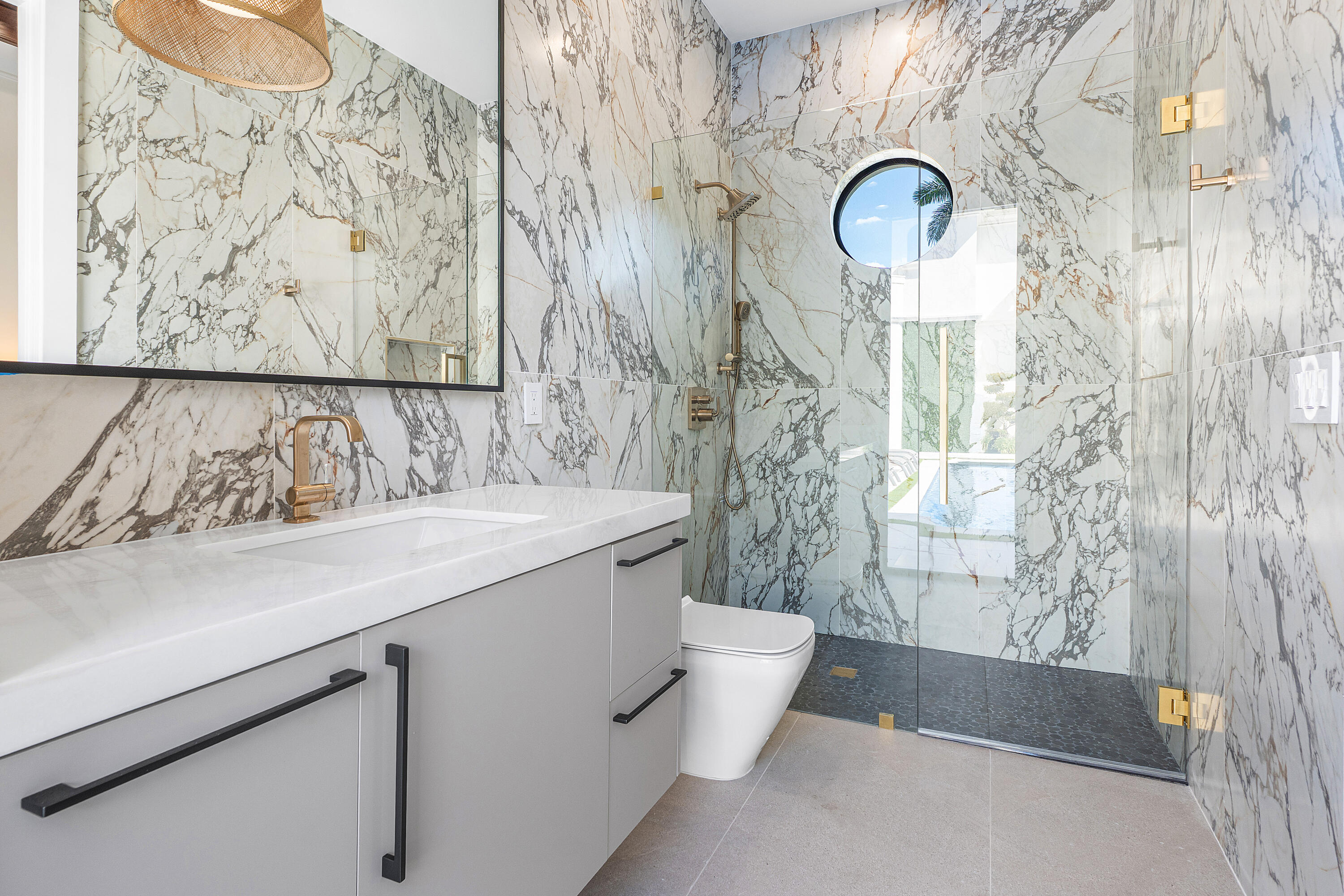 17709 Circle Pond Court Boca Raton, FL 33496 - Photo 39 of 50 a spacious bathroom with a granite countertop sink a toilet and shower