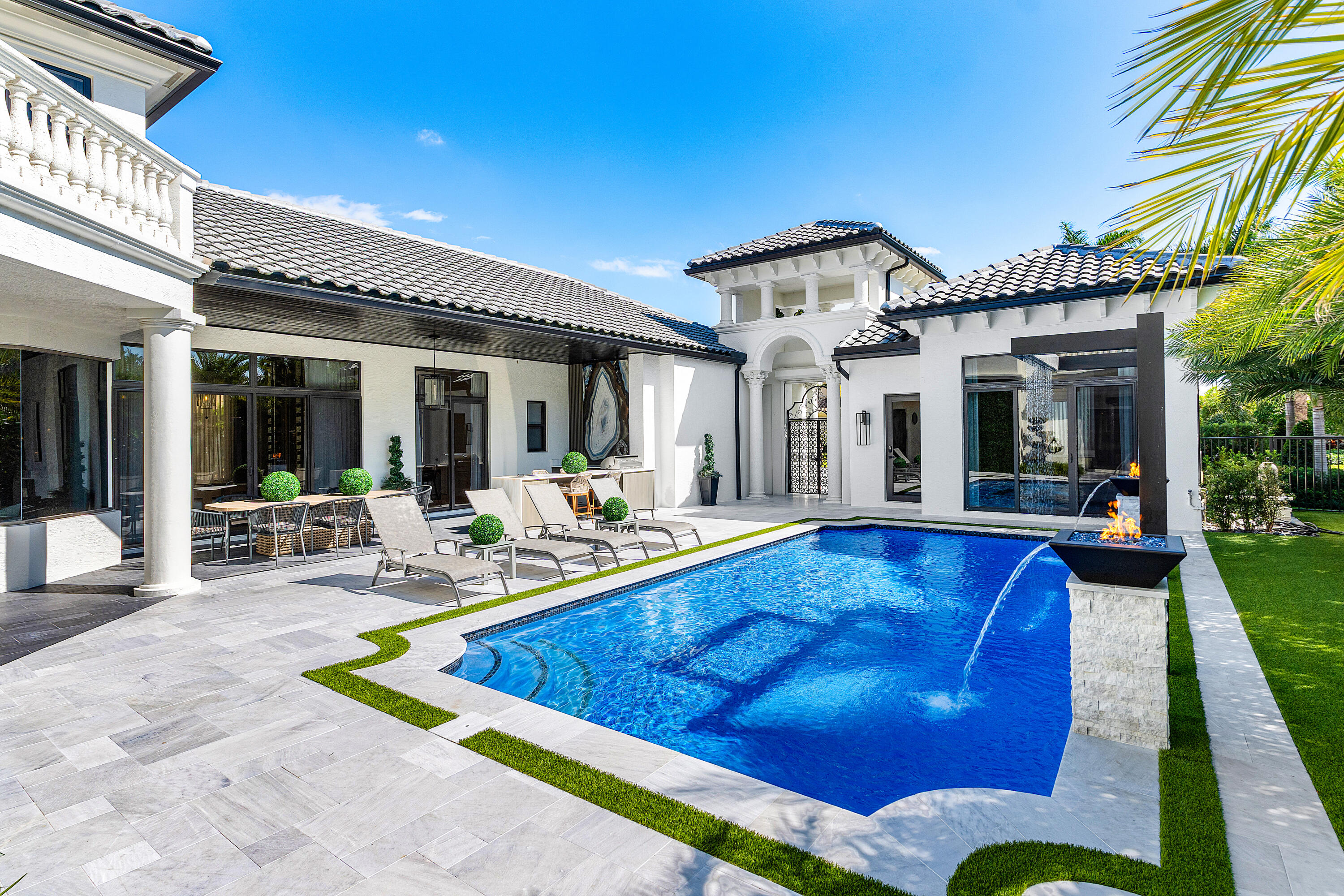 17709 Circle Pond Court Boca Raton, FL 33496 - Photo 44 of 50 a view of a house with swimming pool and sitting area