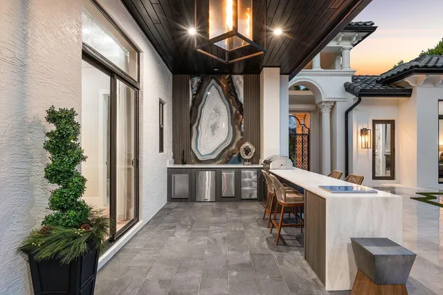 a view of a chairs and table in th patio