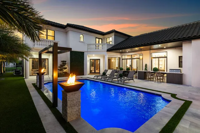 a view of a patio with a table chairs and a patio