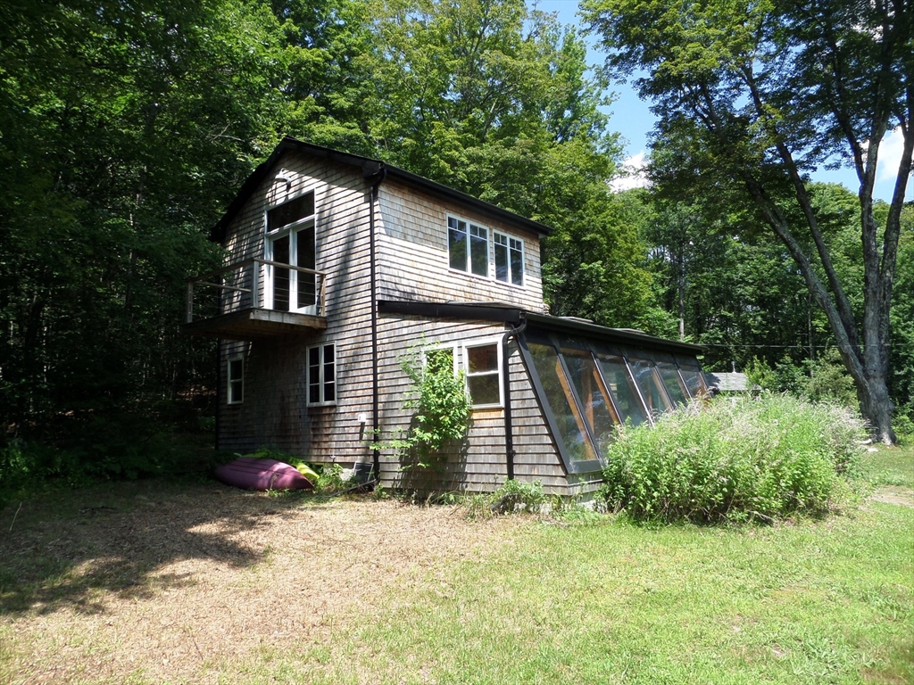 269 River Road Worthington, MA 01098 - Photo 1 of 32 a backyard of a house with seating space
