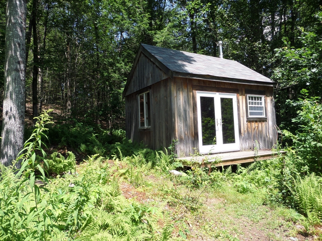269 River Road Worthington, MA 01098 - Photo 23 of 32 a view of house with yard and sitting area