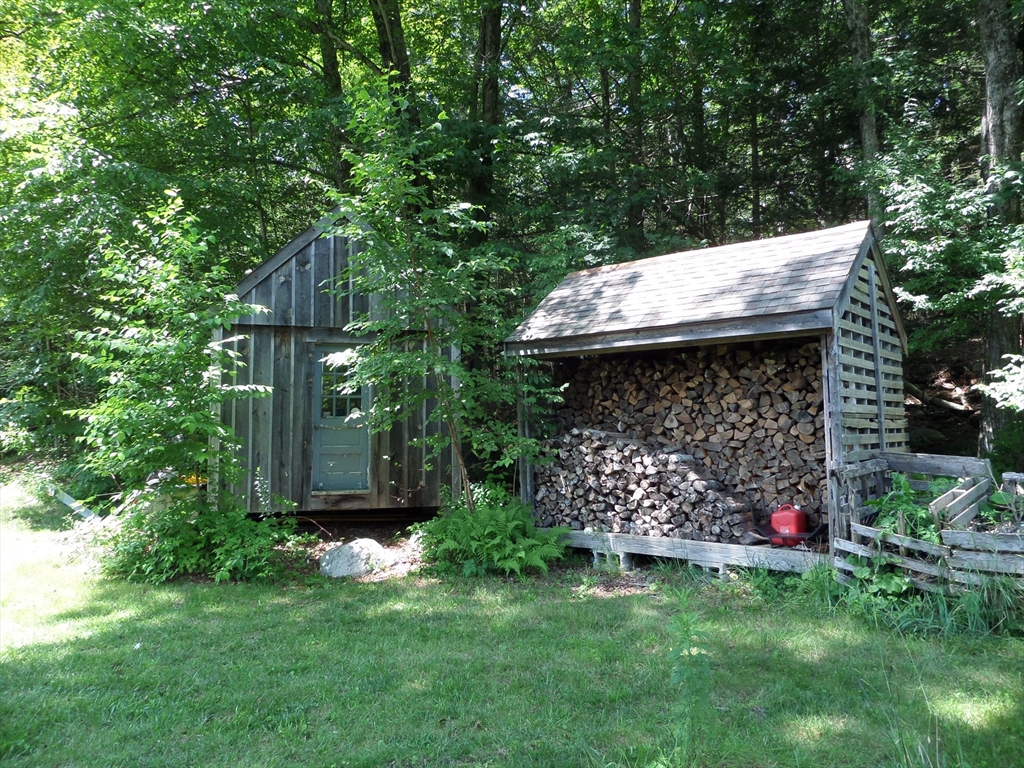 269 River Road Worthington, MA 01098 - Photo 27 of 32 a view of a wooden house with a yard