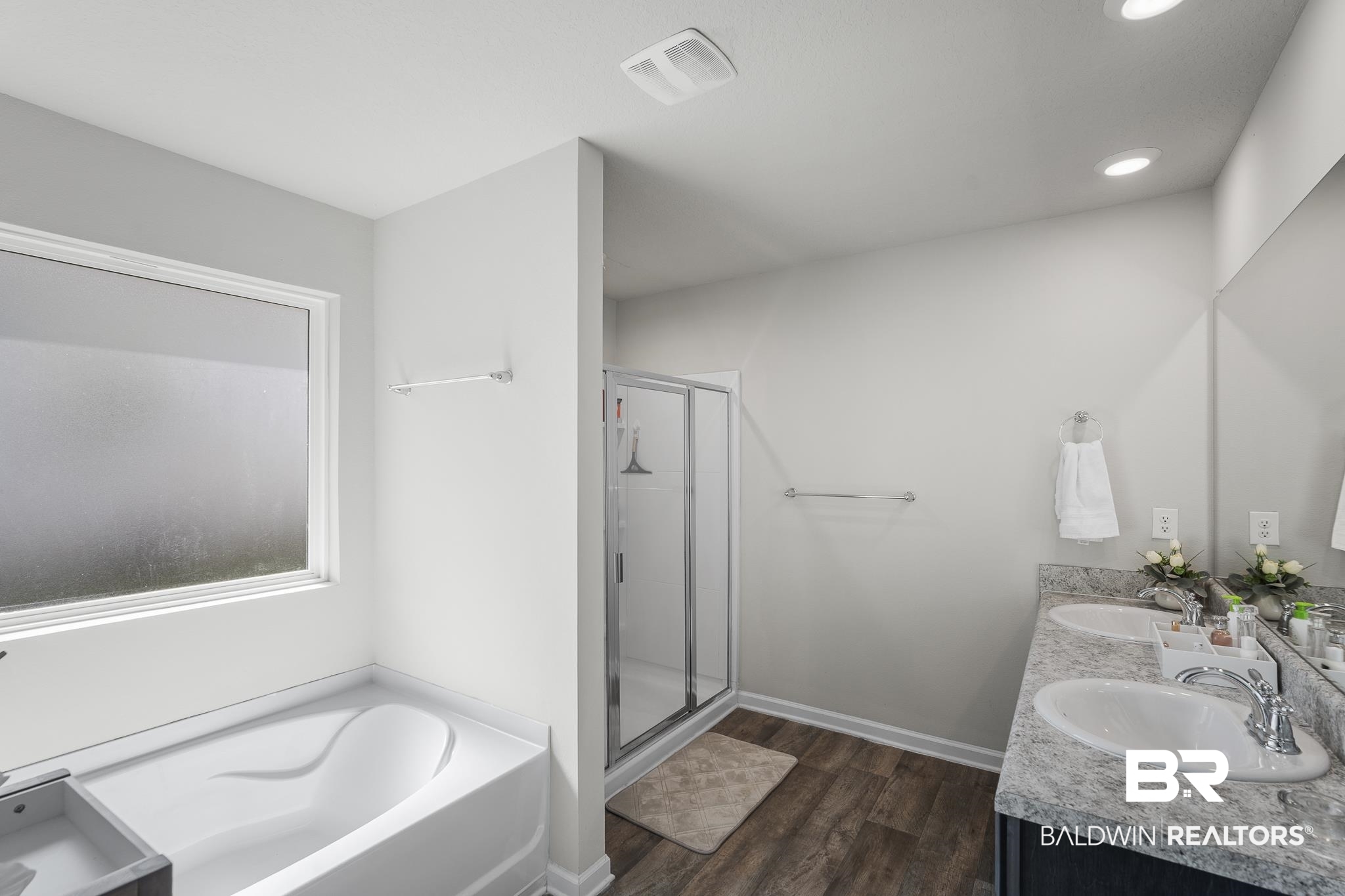 10232 Brodick Loop Spanish Fort, AL 36527 - Photo 18 of 29 Full bathroom with a garden tub, a shower stall, double vanity, wood finished floors, and recessed lighting