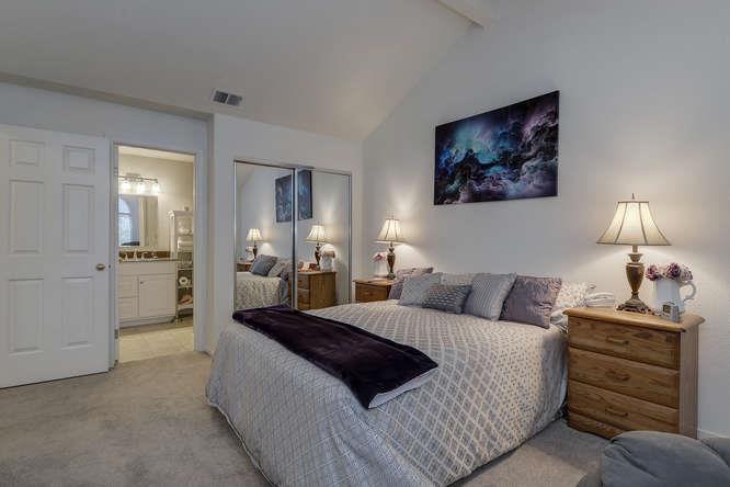 108 Arbor Way Milpitas, CA 95035 - Photo 22 of 26 a bedroom with a bed and a lamp