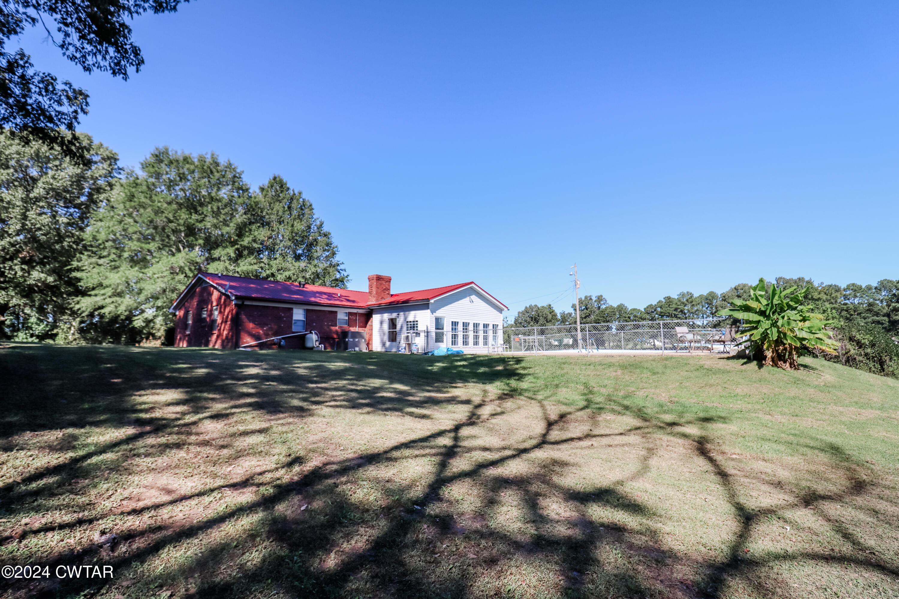 2046 Barlow Road Ripley, TN 38063 - Photo 27 of 28 a view of a yard in front of a house with a large tree