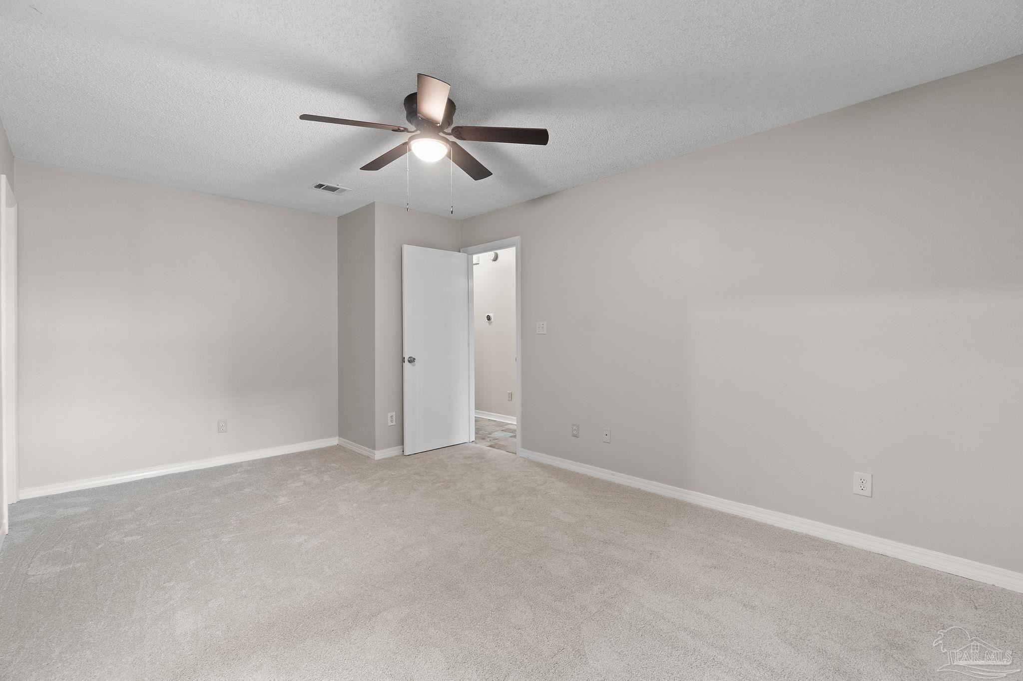 3440 Riverside Drive Pensacola, FL 32514 - Photo 12 of 26 a view of an empty room with a fan