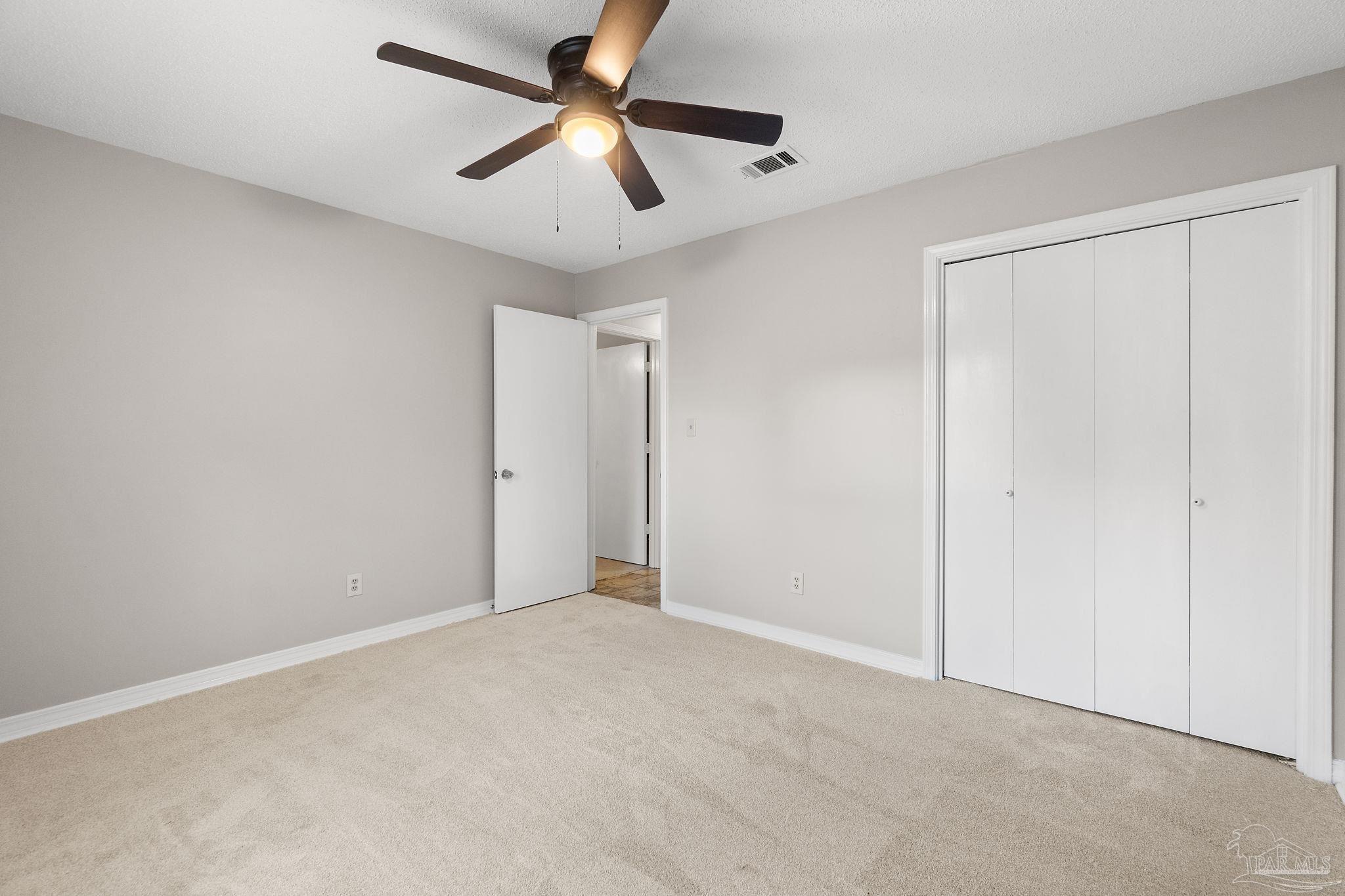 3440 Riverside Drive Pensacola, FL 32514 - Photo 20 of 26 an empty room with ceiling fan