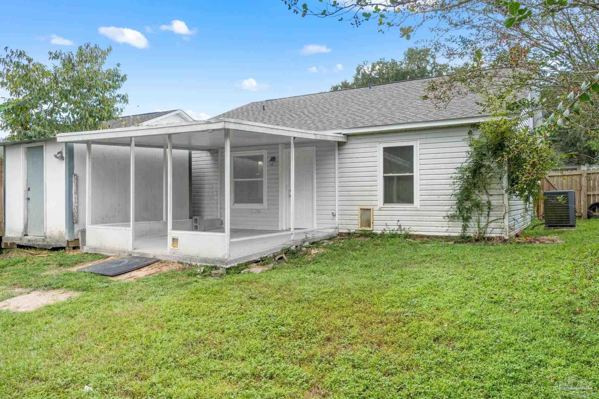 3440 Riverside Drive Pensacola, FL 32514 - Photo 24 of 26 a view of a house with backyard and garden