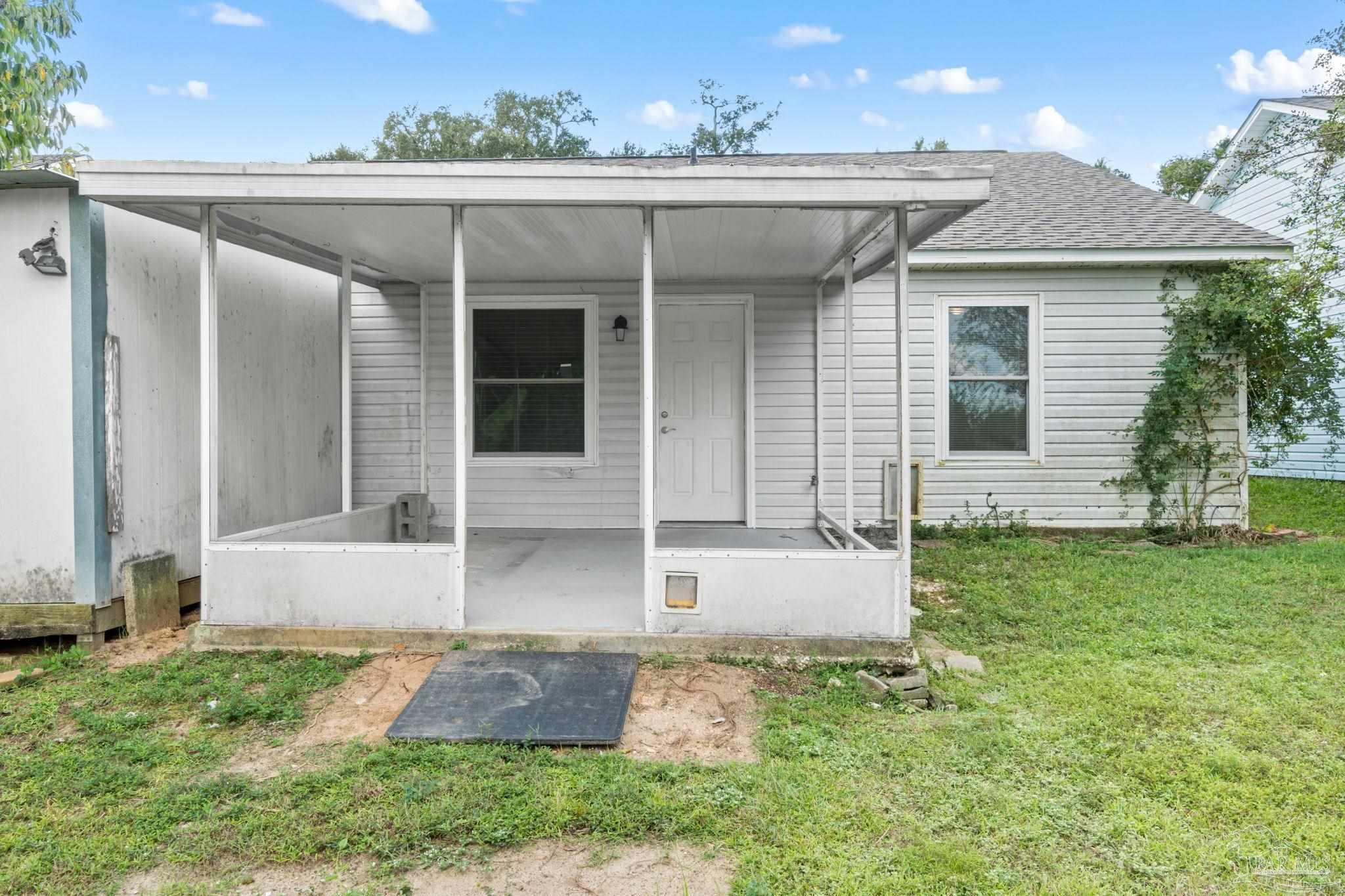 3440 Riverside Drive Pensacola, FL 32514 - Photo 25 of 26 front view of a house with a yard