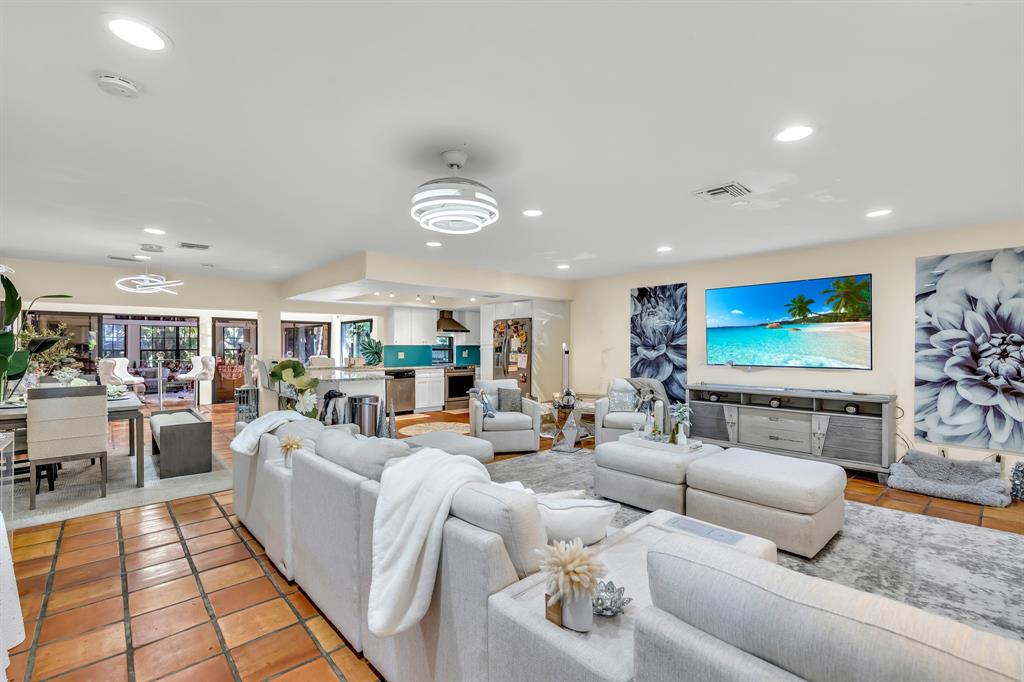 980 Southwest 70th Avenue Plantation, FL 33317 - Photo 11 of 42 a living room with furniture and a flat screen tv