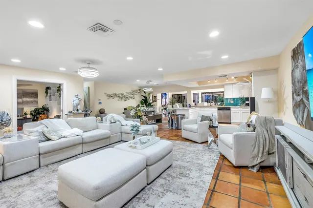a living room with furniture and a rug