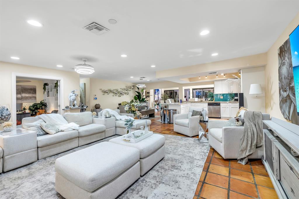 980 Southwest 70th Avenue Plantation, FL 33317 - Photo 12 of 42 a living room with furniture and a rug