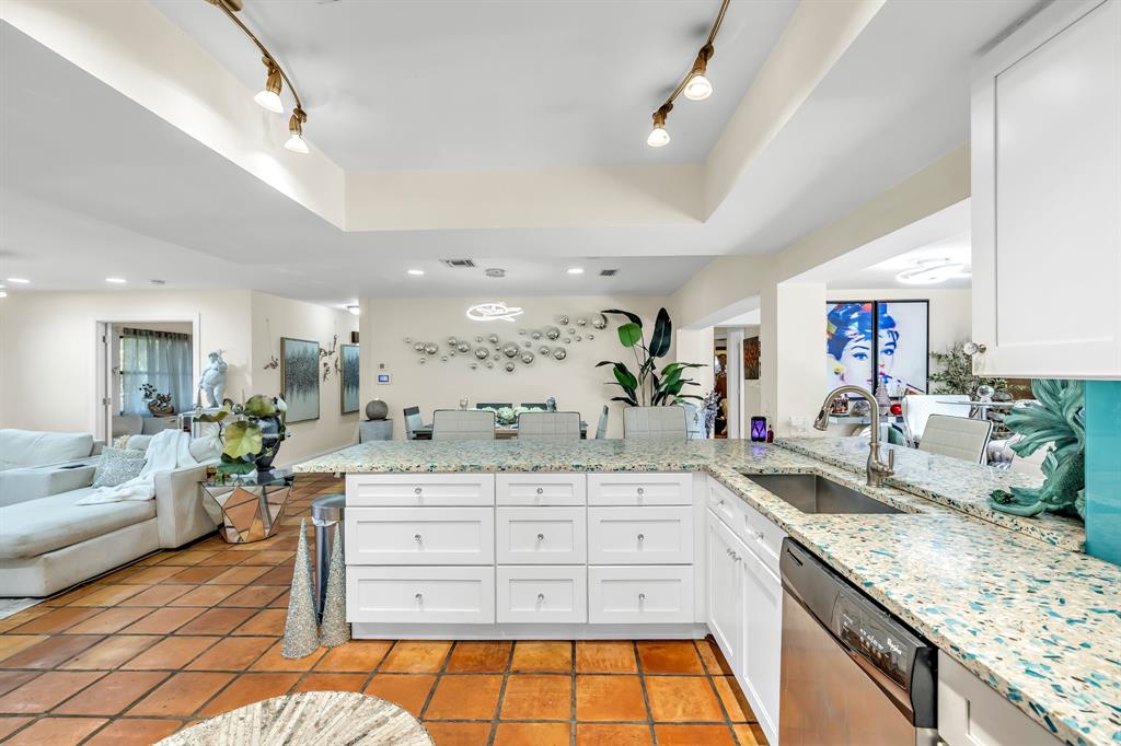 980 Southwest 70th Avenue Plantation, FL 33317 - Photo 19 of 42 a kitchen with a sink stove and cabinets