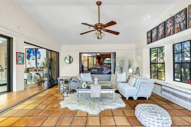 a living room with furniture a window and a table