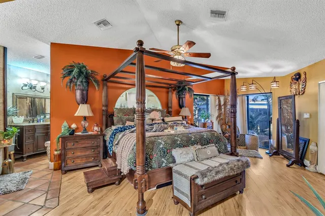 a living room with furniture a fireplace and a table