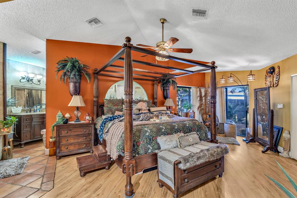 980 Southwest 70th Avenue Plantation, FL 33317 - Photo 30 of 42 a living room with furniture a fireplace and a table