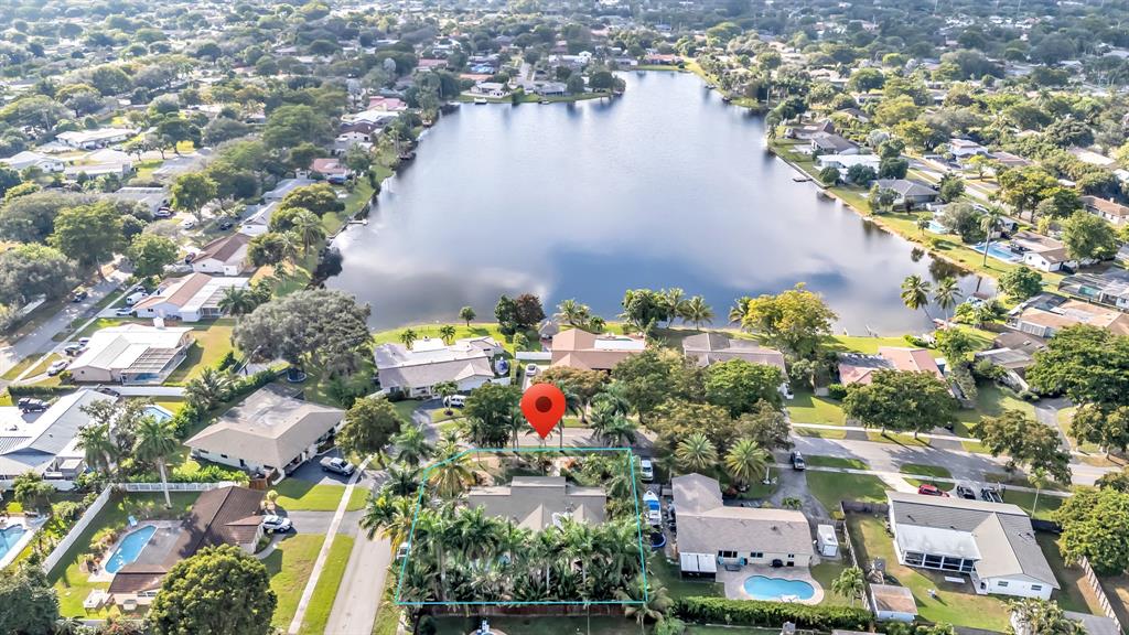 980 Southwest 70th Avenue Plantation, FL 33317 - Photo 3 of 42 an aerial view of residential houses with outdoor space
