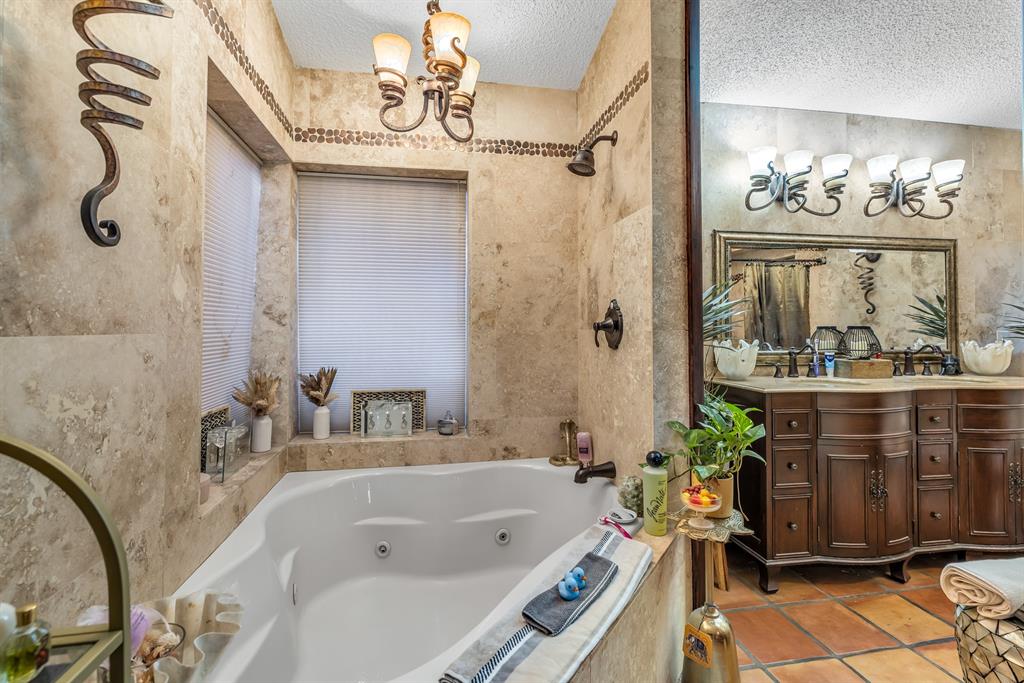 980 Southwest 70th Avenue Plantation, FL 33317 - Photo 32 of 42 a bathroom with a tub sink and mirror