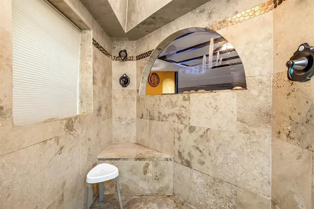 a bathroom with a sink and mirror