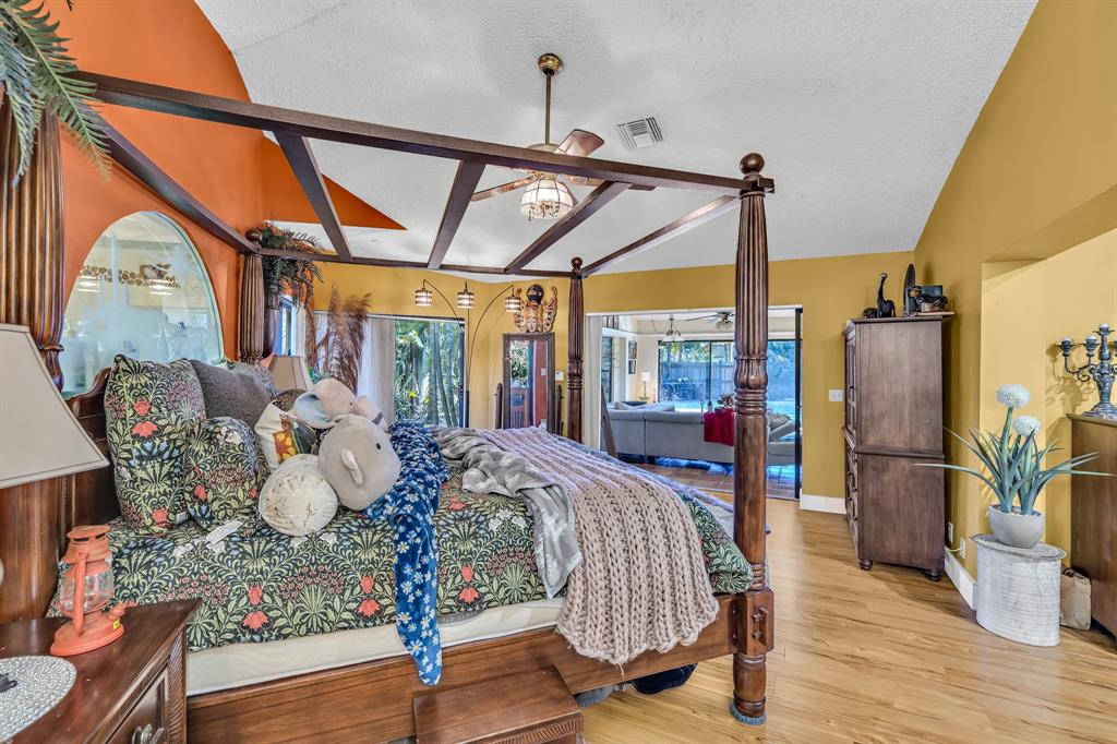 980 Southwest 70th Avenue Plantation, FL 33317 - Photo 36 of 42 a view of a dining room with furniture wooden floor and a chandelier