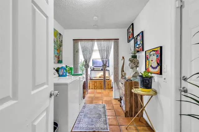 a view of entryway with furniture and wooden floor