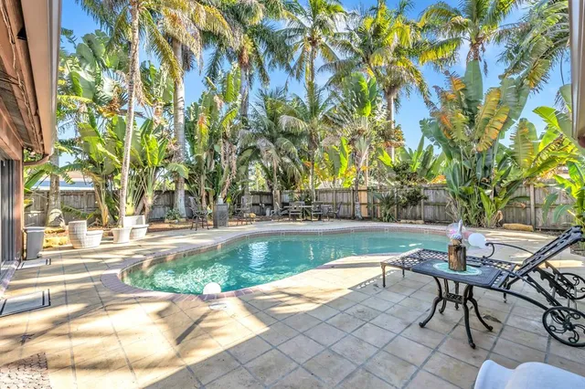 a view of a swimming pool with a patio