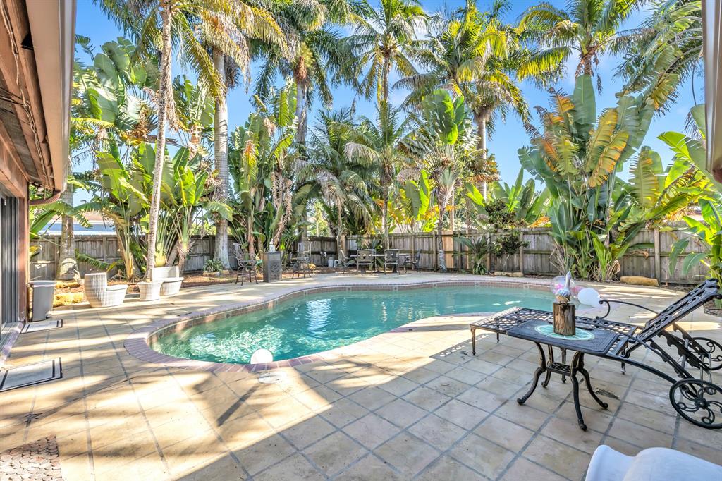 980 Southwest 70th Avenue Plantation, FL 33317 - Photo 38 of 42 a view of a swimming pool with a patio