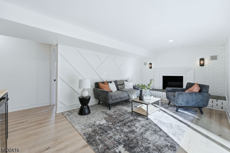 962 Brown Road Bridgewater, NJ 08807 - Photo 23 of 46 a living room with furniture and a flat screen tv