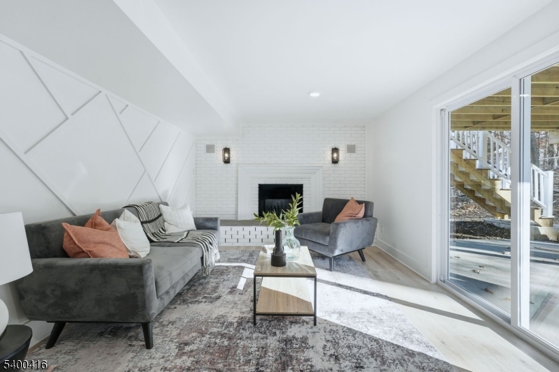 962 Brown Road Bridgewater, NJ 08807 - Photo 24 of 46 a living room with furniture and a fireplace