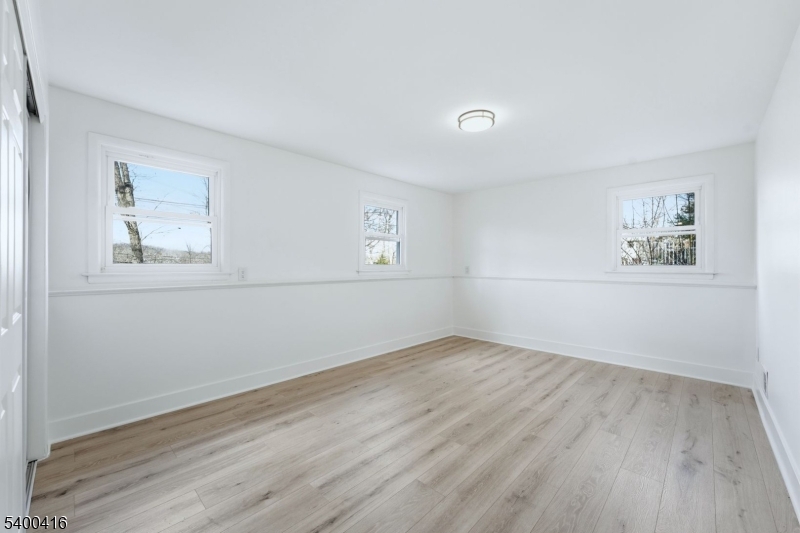 962 Brown Road Bridgewater, NJ 08807 - Photo 29 of 46 a view of empty room with wooden floor and fan