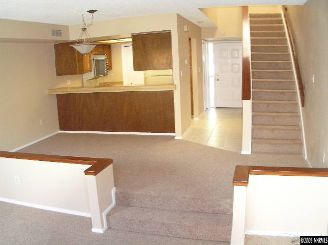 a view of kitchen with furniture and wooden floor