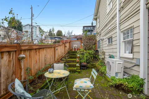a view of a balcony with chairs and a table