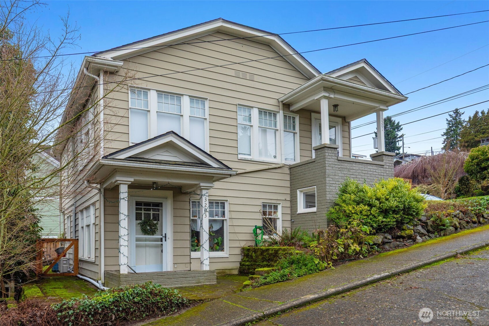 3201 South Charles Street Seattle, WA 98144 - Photo 3 of 23 front view of a house with potted plants